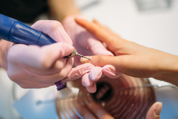 beautician-polishing-nails-of-client-top-view-2024-11-26-16-43-21-utc (1)
